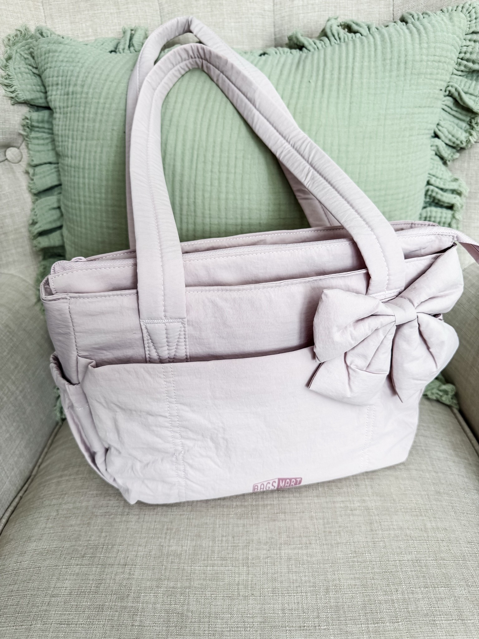 Mini Bagsmart bow bag - this is the small
Version

#LTKU #LTKHome #LTKTravel