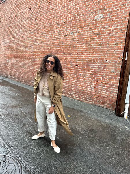 Happy 😃. I thought I did a great job packing for this trip and still ended up borrowing Natalie’s trench. This exact one is not available, but I’ve linked a couple that are similar and oversized. The new style by this brand just released and I’ve linked it also. 
Sweater size down @mareathebrand 
Pants @everlane tts 
Shoes tts @fredasalvador use code HGC20LA until 3/5
Sling bag @abbyalleythebrand 
Long sleeve white tee shirt size up @lululemon 
Sunglasses 😎 coming soon to @nataliebortondesign

#LTKstyletip #LTKfindsunder100 #LTKtravel