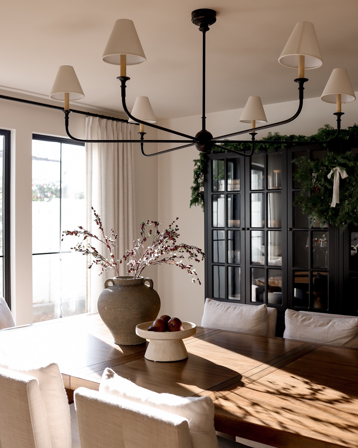 Holiday dining room! Shop my dining table, dining chairs, holiday stems, holiday garland, holiday wreath 

#LTKSeasonal #LTKHome #LTKHoliday