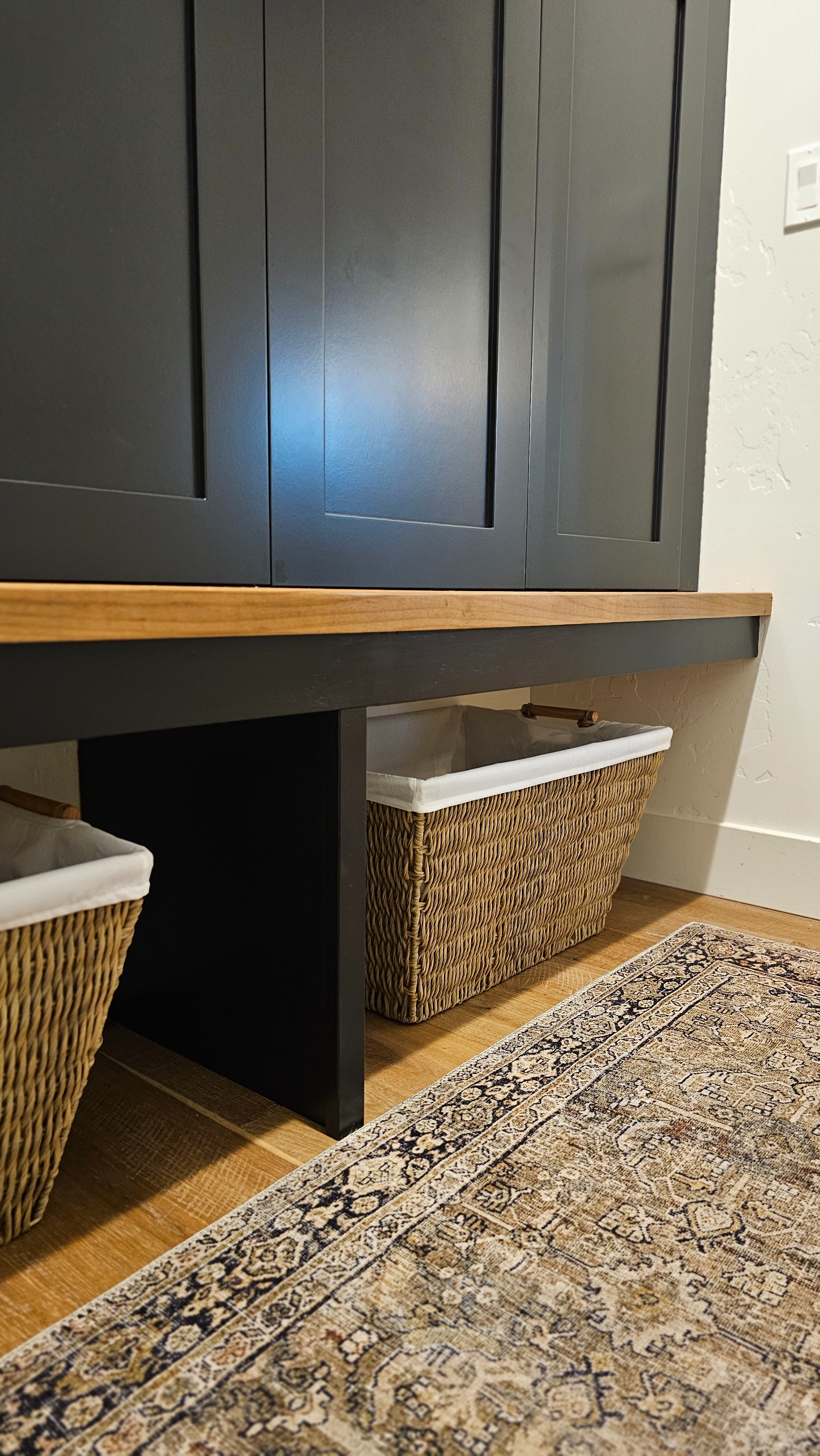 The most perfect aesthetically pleasing combo! I love the moody black mudroom cabinets storage plus the rug and the perfect shoe storage baskets. It's just all working perfectly!

#LTKHome