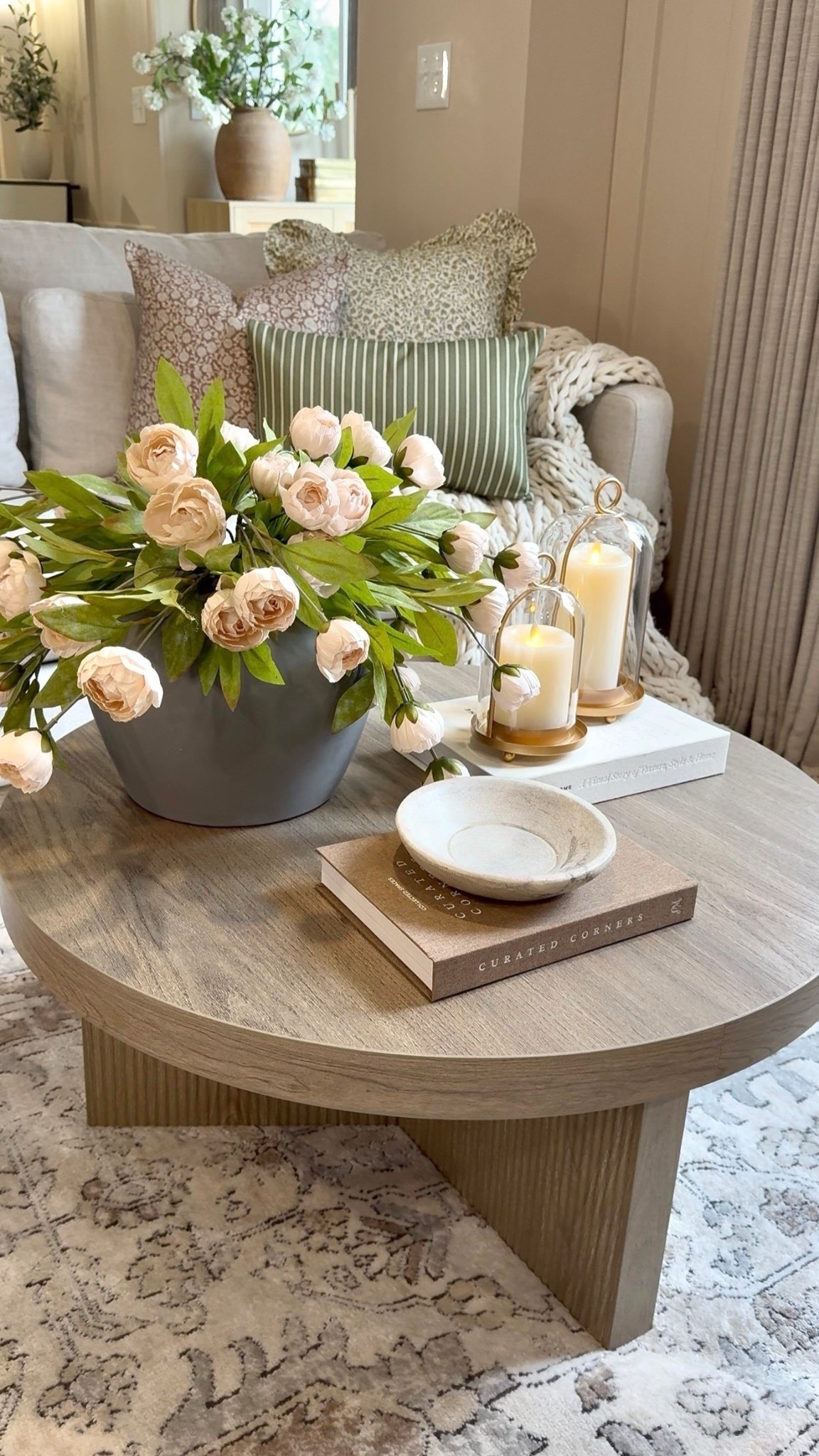 Round Coffee Table Styling

Follow @farmtotablecreations on Instagram for more

Simple layers make all the difference on a round coffee table. Flowers first for that fresh spring focal point, then layered in books, warm glass hurricanes, and finished with a beautiful marble bowl for that balanced, collected look.

Also sharing these beautiful spring pillow covers from @Woven Nook … such an easy seasonal refresh.

For reference: 12 stems in vase.

#coffeetable #coffeetablestyling #pillows #livingroomdecor #livingroomfurniture #roundcoffeetable #springcoffeetable #coffeetabledecor


#LTKSaleAlert #LTKHome