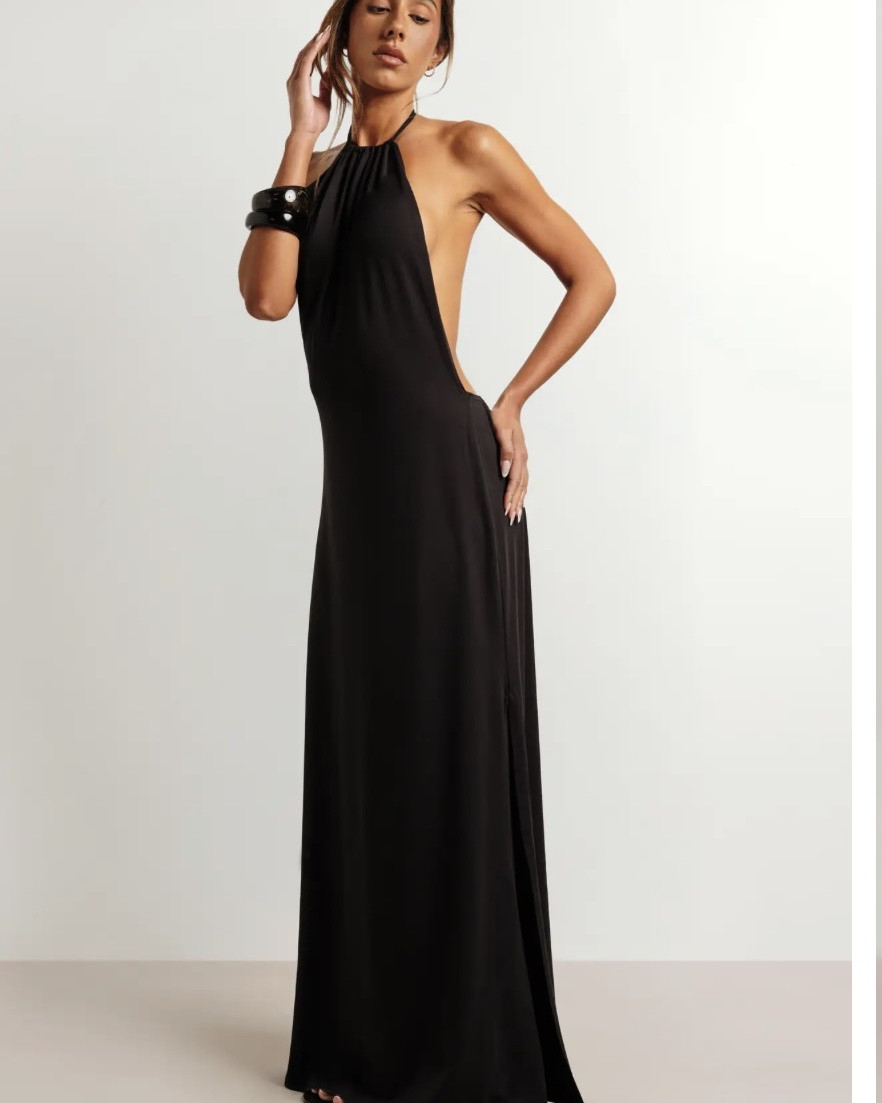 Ruched halter neckline with a gathered detail that draws the eye upward for an effortlessly refined finish
Dramatically open low back design that makes this maxi a true standout from every angle
Super soft fabric with a smooth, fluid-free drape that skims the body all the way to the floor
Maxi length with a subtle flared hem, offering graceful movement as you walk
Sleeveless, open-sided silhouette that keeps the look minimal and striking without any added fuss
This halter maxi dress is the kind of piece that does all the talking for you. The ruched neckline ties everything together at the front, while the deeply open back steals the show - a combination that works brilliantly for a summer evening out, a rooftop gathering, or a special dinner date. The super soft fabric drapes beautifully to the floor, giving the whole look an easy, effortless feel that never tries too hard. Style it as the model does, with chunky statement bracelets and hoop earrings to lean into that bold, minimal aesthetic. Strappy heeled sandals will elongate the silhouette perfectly, while a sleek updo lets the open back take centre stage. Whether you're heading to a birthday celebration, a beach holiday dinner, or a summer wedding as a guest, this dress transitions seamlessly from golden hour to late-night dancing with zero effort required.
@boohoo

#LTKSaleAlert #LTKdayinmylife #LTKU