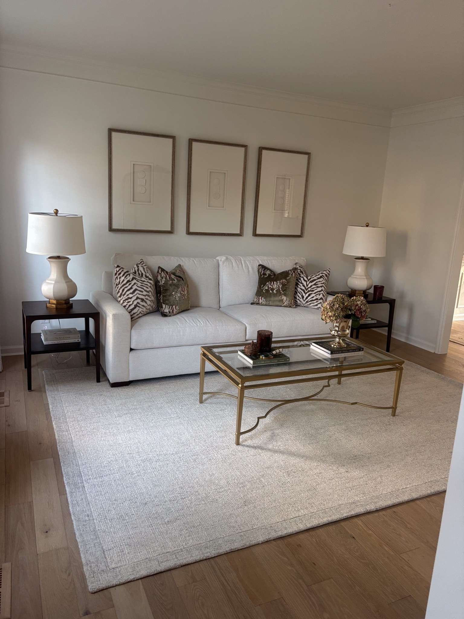 Obsessed with how my sitting room turned out🤎 going to eventually add some accent chairs but I’m loving it so much! The rug is a 9x12 and pillow covers are 20x20 covers and 22x22 inserts for fullness!

#LTKHome