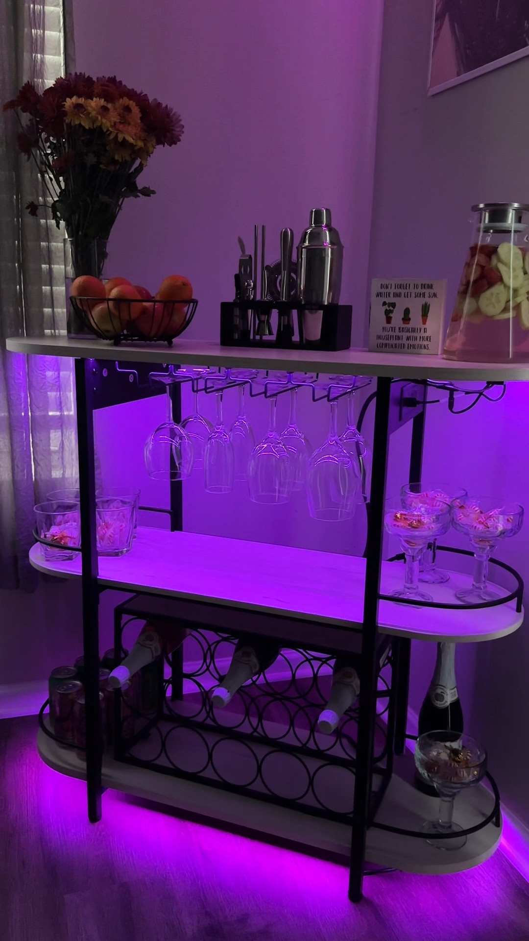 Pov: elevating my apartment with a mocktail bar😍

Transform your holiday gatherings with this incredible mini bar! The vibrant LED lights set the perfect atmosphere, whether you're unwinding with a cozy night in or celebrating with friends and family. I absolutely love how it features 2 outlets and 2 USB ports for all your gadgets. Plus, the removable wine rack can comfortably hold up to 15 bottles, ensuring your favorite drinks are always within reach. And let's not forget the stylish glass holder that accommodates 8 to 12 glasses. This mini bar is truly a fabulous addition to any apartment or home!

#LTKHome #LTKHoliday #LTKWatchNow