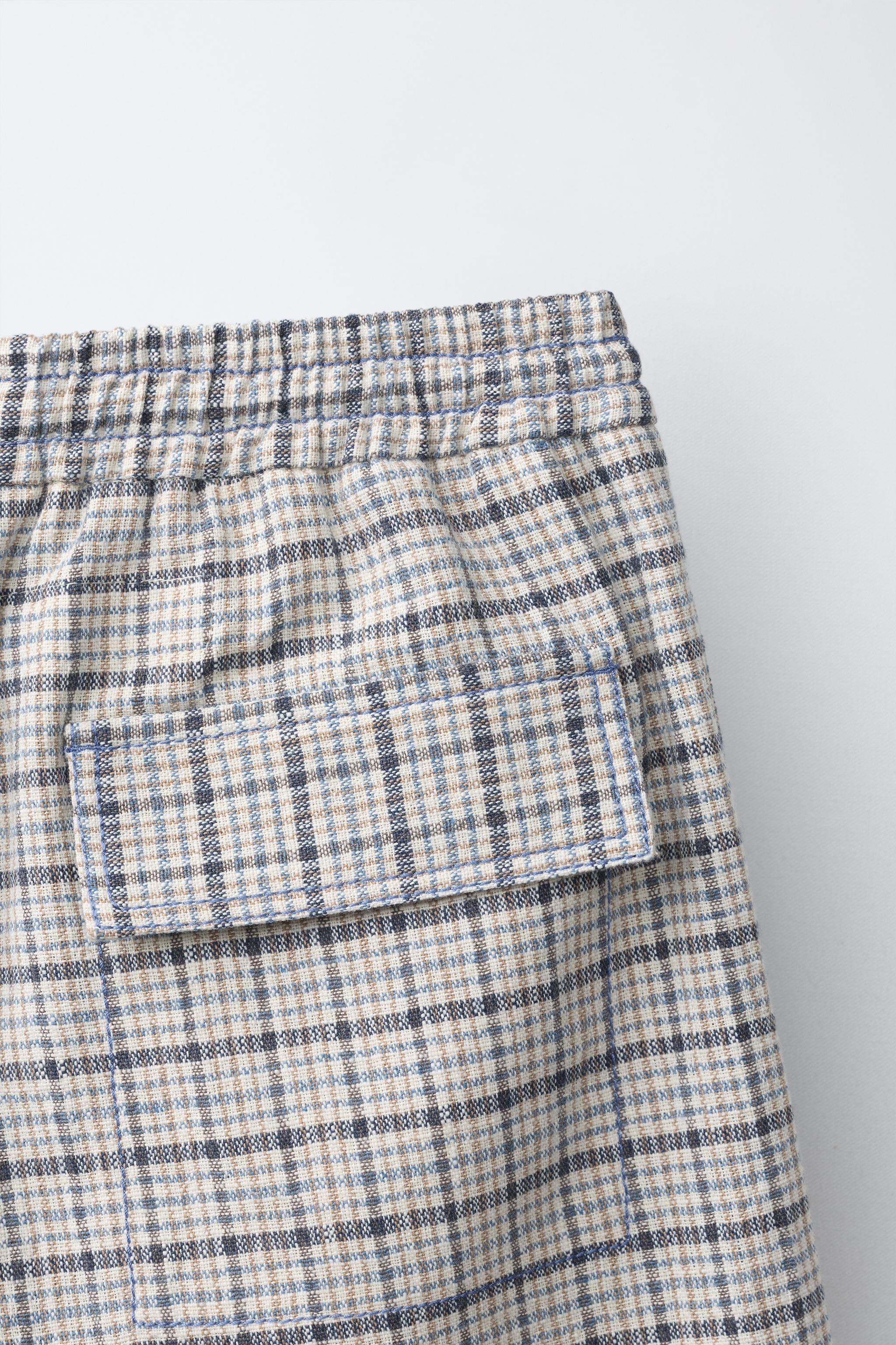 Shorts with elastic waistband and adjustable front drawstrings. Front pockets with contrasting to... | Zara US