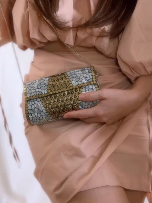 A true statement clutch ✨

This structured clutch inspired by intricate mosaic designs is fully embellished with shimmering gold and silver-tone details, creating a luxurious and eye-catching finish. The rigid silhouette adds elegance and sophistication, making it the perfect piece to elevate any outfit.

I love how it reflects the light beautifully and instantly transforms even the simplest look into something special. Ideal for evening events, celebrations, or whenever you want your accessories to stand out.

Tap to explore similar styles and add a touch of sparkle to your collection 🤍

#LTKespana #LTKeurope #LTKbag