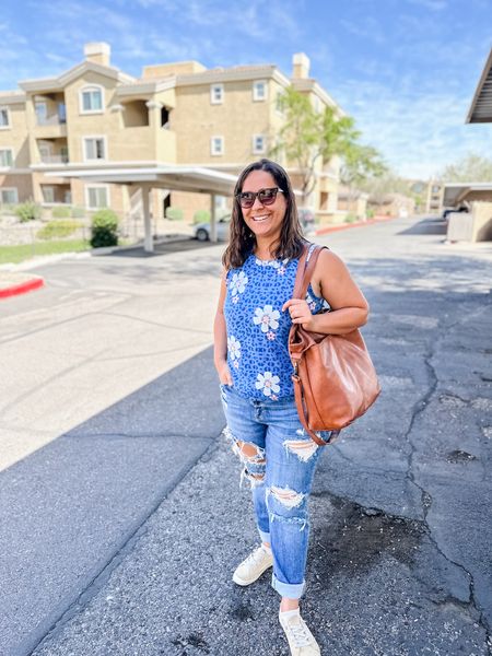 Casual spring outfit. This tank is long, more like a tunic - so I tucked it under for a shorter look. It comes in a ton of colors and patterns. Super comfy and flattering! Also, this faux leather tote is my favorite right now. I literally use it every day!

#LTKfindsunder50 #LTKmidsize #LTKSeasonal