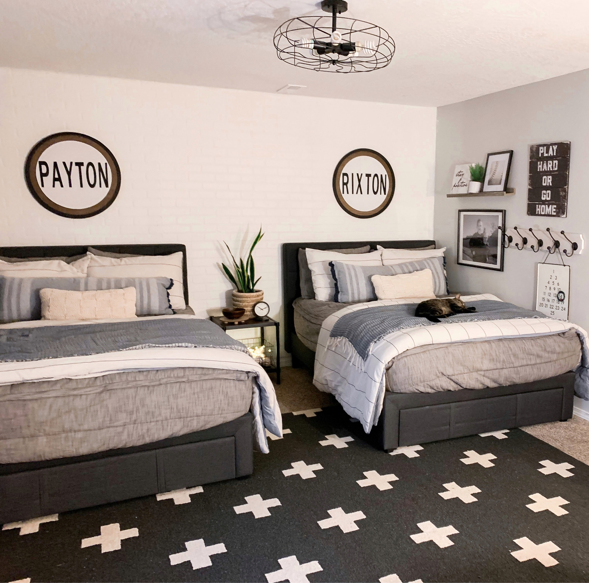 Boys Bedroom~ my boys bed with the storage underneath isn’t currently available. I’ve linked the same style bed but it just doesn’t have the pull out drawer. They have Full size beds. The base bedding is from Beddy’s (style Franklin). Code MYHOUSE takes 20% off their site, but I can’t link it in this platform. 
Platform Bed 
Bedding and Pillows 
Bedroom light 
Black and white patterned rug 


#LTKhome #LTKkids #LTKFind
