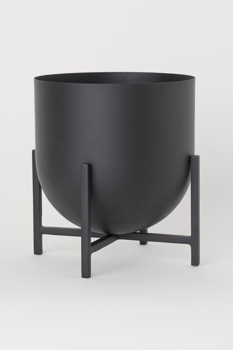 Metal plant pot with a rounded base on a metal pedestal. Pot diameter 8 3/4 in., height 8 1/2 in.... | H&M (US + CA)