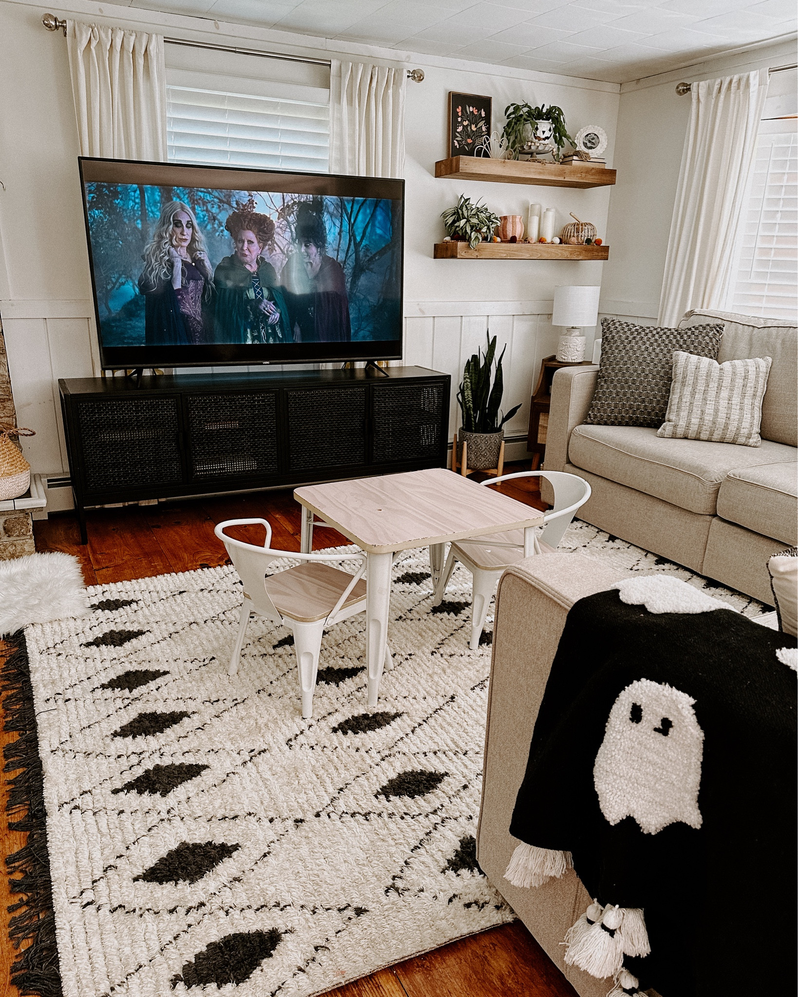 Cozy living room update. Loving this black tv stand!