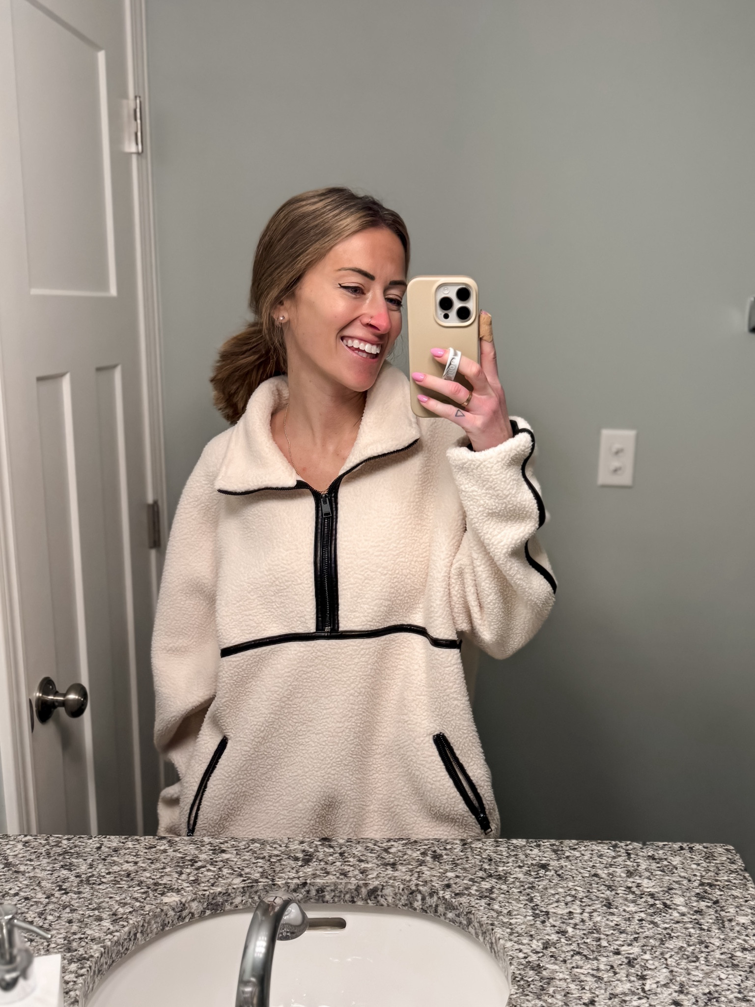 LAMARQUE Helsa pullover from
Revolve is perfect for cold weather outfit ideas and spring soccer mom style 