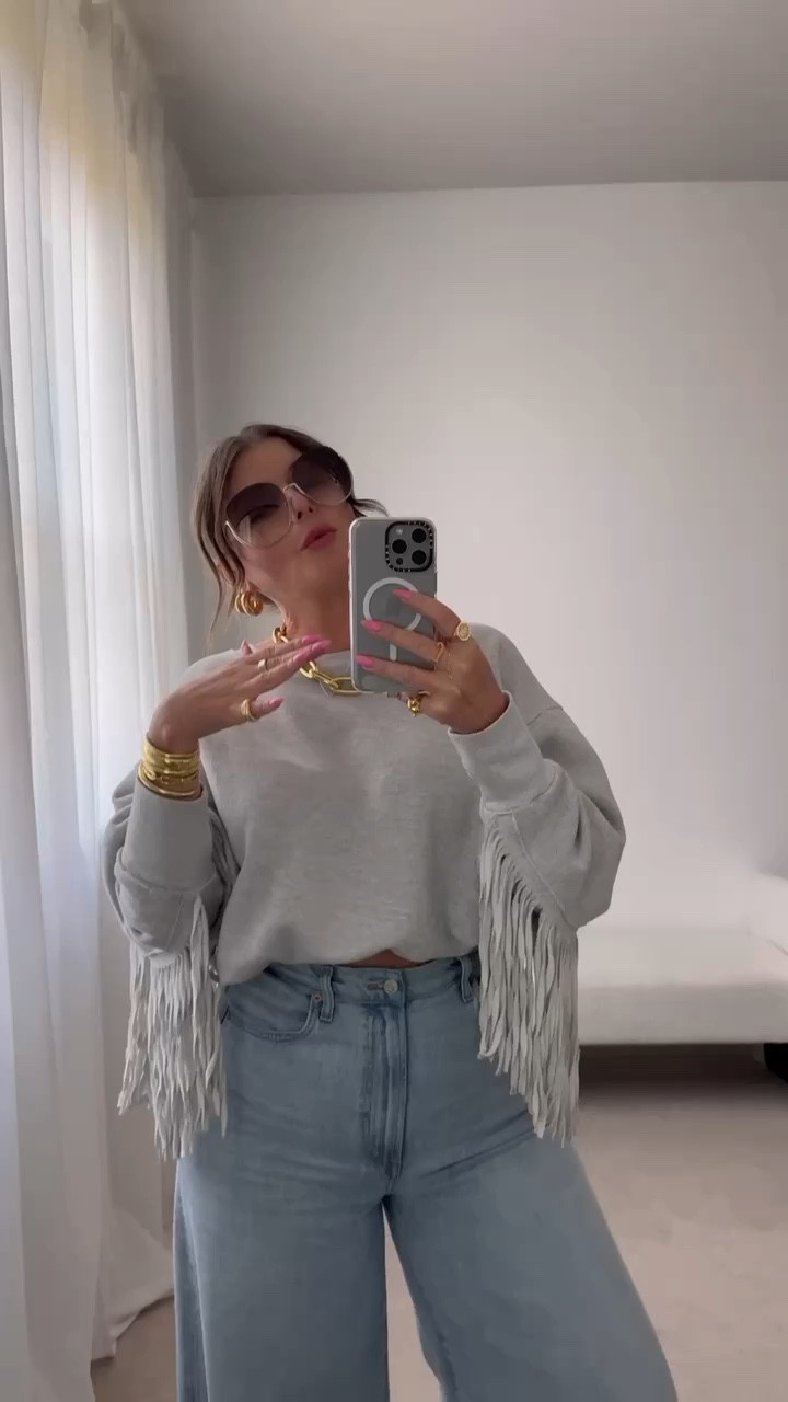 To crop this fringe sweatshirt I used an elastic waistband from Amazon. It’s really come in handy!

Top & Wide leg jeans both run true to size. I’m wearing a medium and 29

In the sneakers I’m wearing my true size, reviews said to size down… I did originally but they were too small so I ended up exchanging for my true size.

#LTKSeasonal #LTKStyleTip