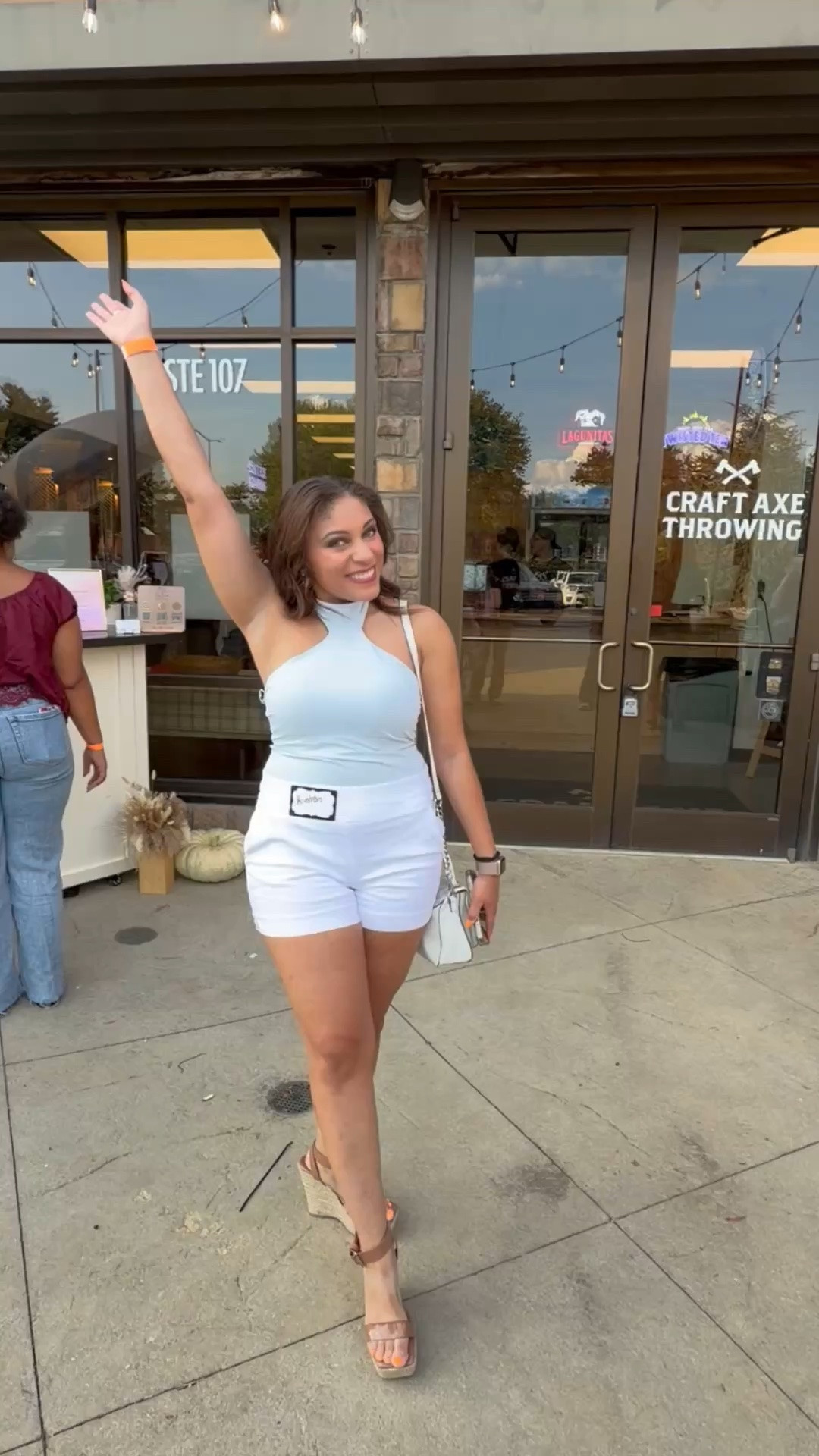 Blue halter top, white shirt, white purse, nude heels

#LTKootd #LTKU #LTKSeasonal