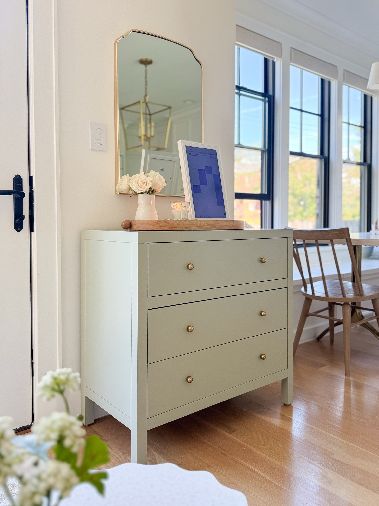 A closer look at the sage green chest in our breakfast nook. I love incorporating furniture that feels collected and timeless while serving a practical purpose. The soft, muted green adds just the right amount of color, the brass hardware gives it an elevated touch, and the three drawers provide much-needed hidden storage for table linens, placemats, and all the little extras. A beautiful alternative to a traditional dining room server! 🤍

#LTKSaleAlert #LTKHome #LTKdayinmylife
