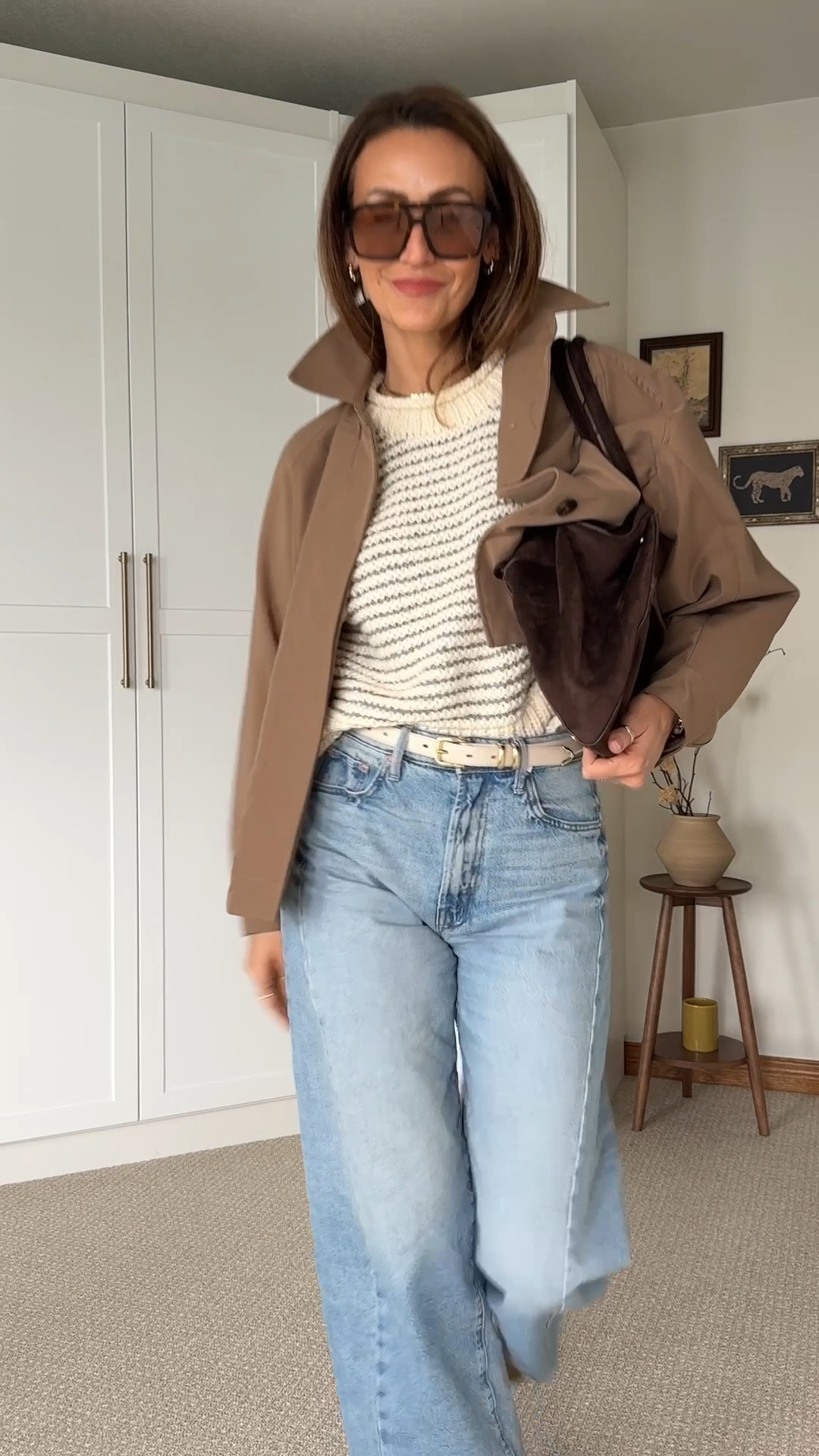 Day 2 of Jeans Outfits 👖✨ these crop barrel like jeans have been on the best selling list everywhere. I love them so much I just ordered the cream with black color. Styling with a crop chunky knit sweater and a cape trench. My best find the suede travel tote bag is a major steal and looks even better in person. 
Size 26 on jeans and xs on sweater 

#LTKItBag #LTKStyleTip #LTKWatchNow