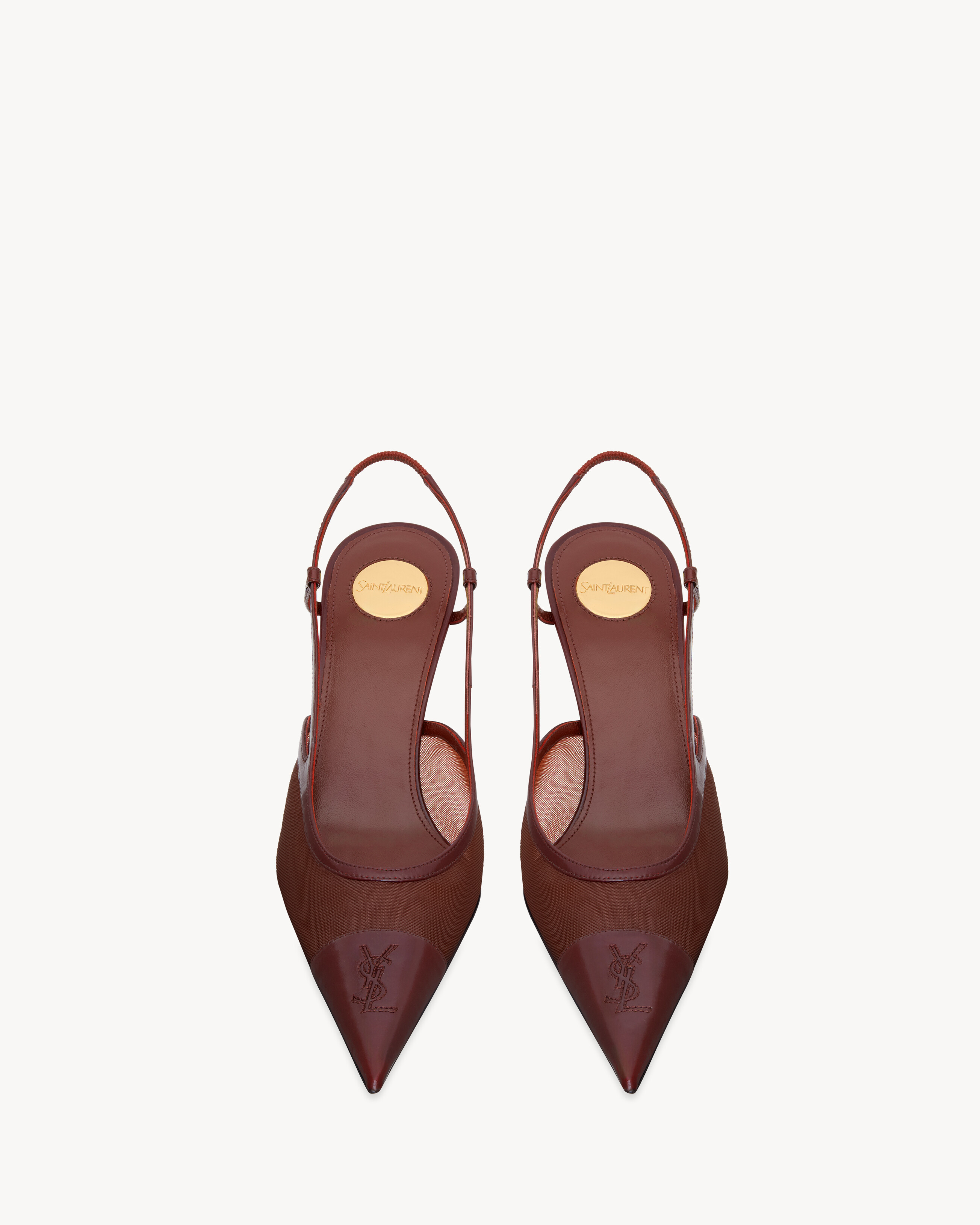 semi-sheer slingback pumps with a stiletto heel and pointed leather-cap toe stitched with the CAS... | Saint Laurent Inc. (Global)