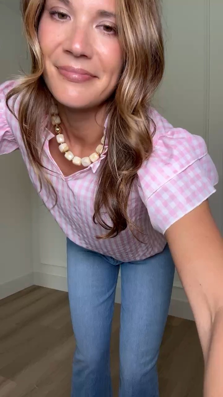I love how this pink gingham top has a feminine feel. Paired with relaxed denim and sandals it’s an easy outfit you can reach for on repeat. It’s perfect for casual days, errands, or lunch plans when you want something simple but still styled.

pink gingham top, ruffle sleeve blouse, light wash denim jeans, casual summer outfit, feminine everyday style, effortless chic outfit, mom style fashion, elevated basics, spring summer outfit ideas, easy everyday look, StangandCo

#LTKootd #LTKTall #LTKSeasonal