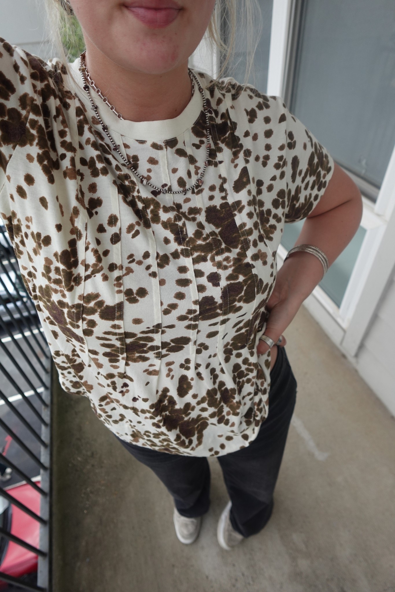     OOTD featuring cow print, classic jeans, and sneakers for an easy western-inspired look ✨ linked on my LTK. #WesternFashion #CasualCowgirl #LTKStyle