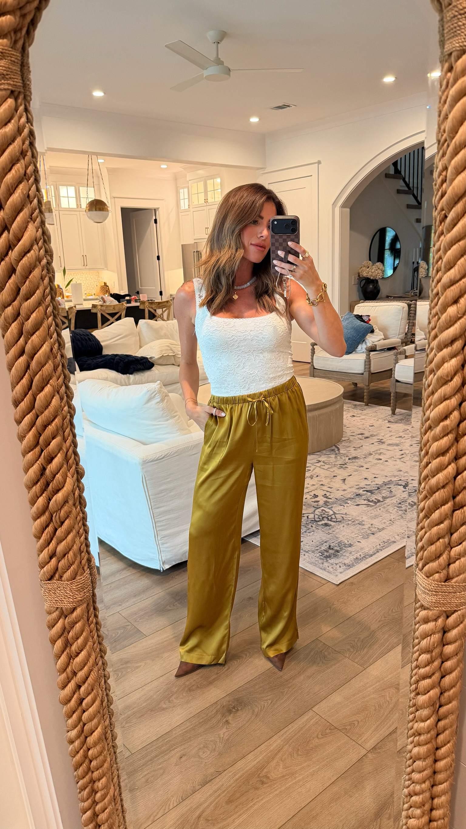 An elevated late-summer look with a white tank and silky golden wide leg pants, simple, polished, and perfect for dinner or vacation.

white tank top, satin pants, wide leg pants, golden pants, summer outfit, vacation outfit, dinner outfit, resort style, chic outfit, neutral style, elevated basics, evening outfit, date night outfit, summer night look, transitional outfit, early fall style, minimalist outfit, classy casual outfit, effortless style, vacation dinner outfit 

 #LTKOver40