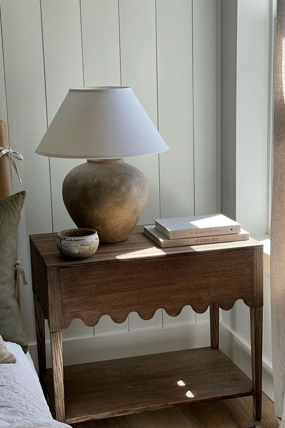 Wooden nightstand table perfectly styled.