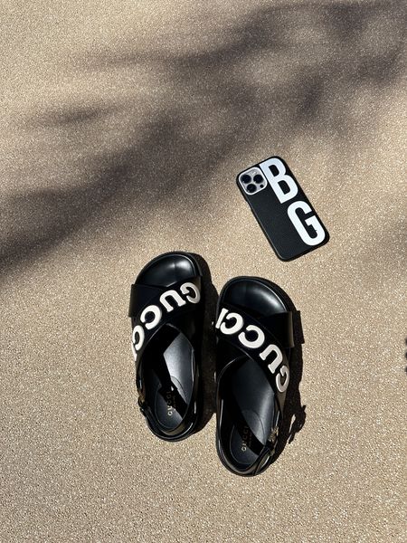 Black gucci sandals with white spell out and custom phone case from bauble bar  

#LTKtravel #LTKFind #LTKshoecrush