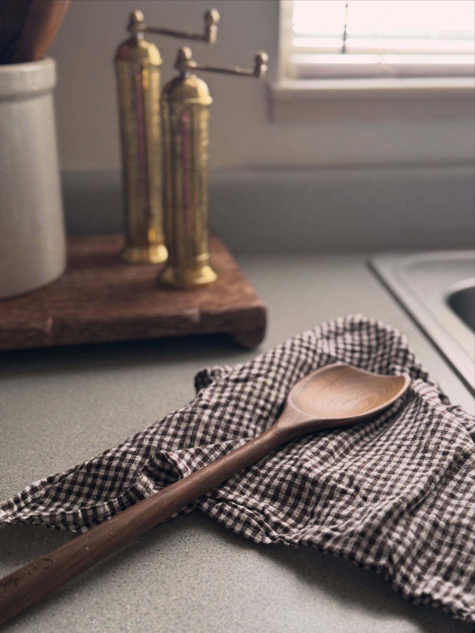 Kitchen decor, ￼ gingham print kitchen towel, ￼ brass salt and pepper grinders, ￼ wood riser, ￼ wood kitchen utensils

#LTKHome #LTKfoodie #LTKSaleAlert