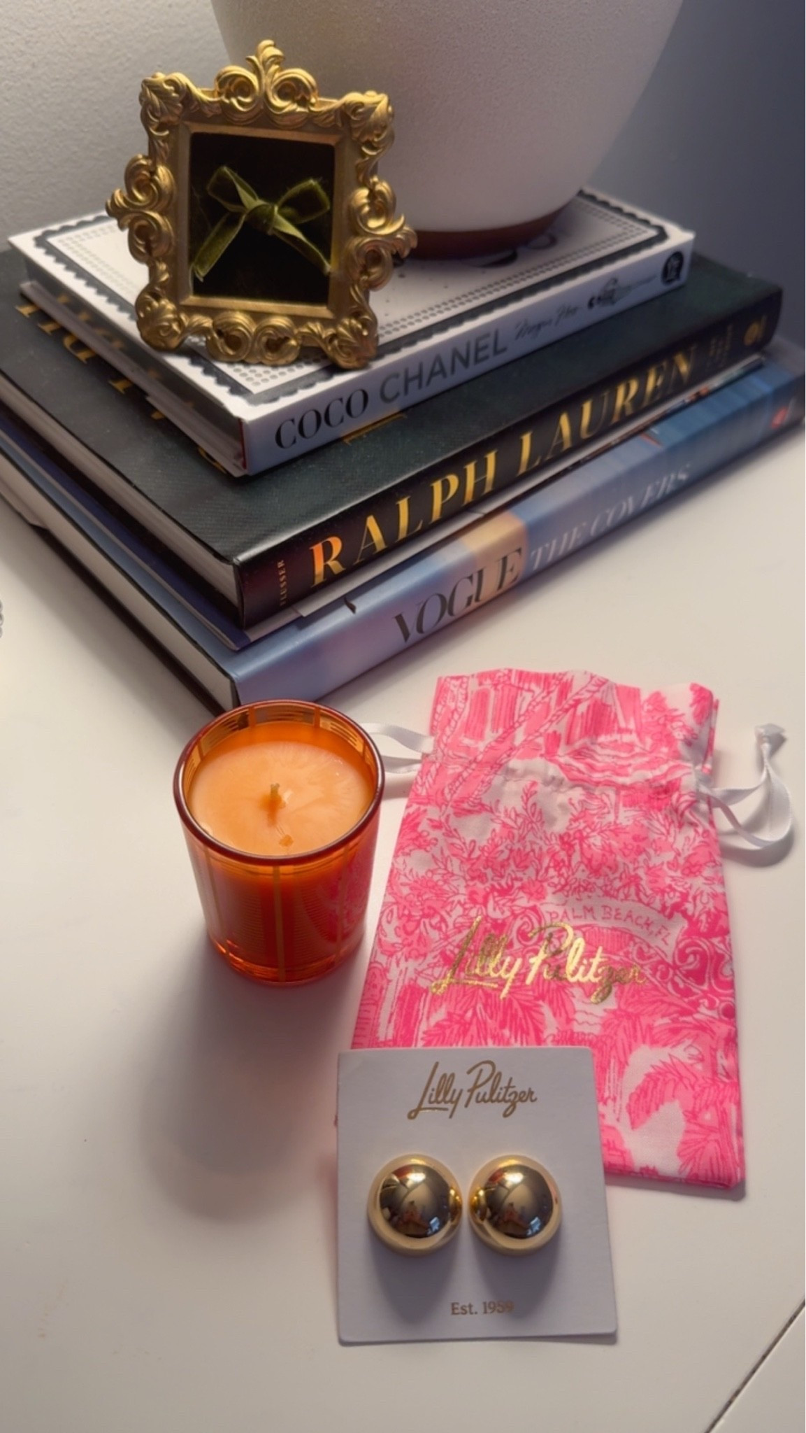 Fall home decor and jewelry finds 🎃🍂 // NEST New York pumpkin chai candle, Lilly Pulitzer gold stud earrings, Chanel, Ralph Lauren, and Vogue coffee table book

#LTKHome #LTKSeasonal