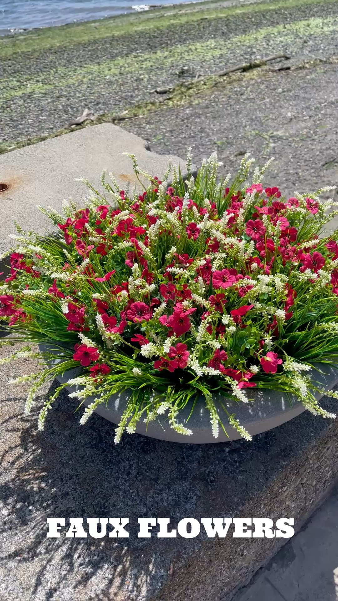 Faux flowers and grass in this durable low profile poly resin outdoor planter are a winner for maintenance free landscaping!

#LTKdayinmylife #LTKHome #LTKSaleAlert