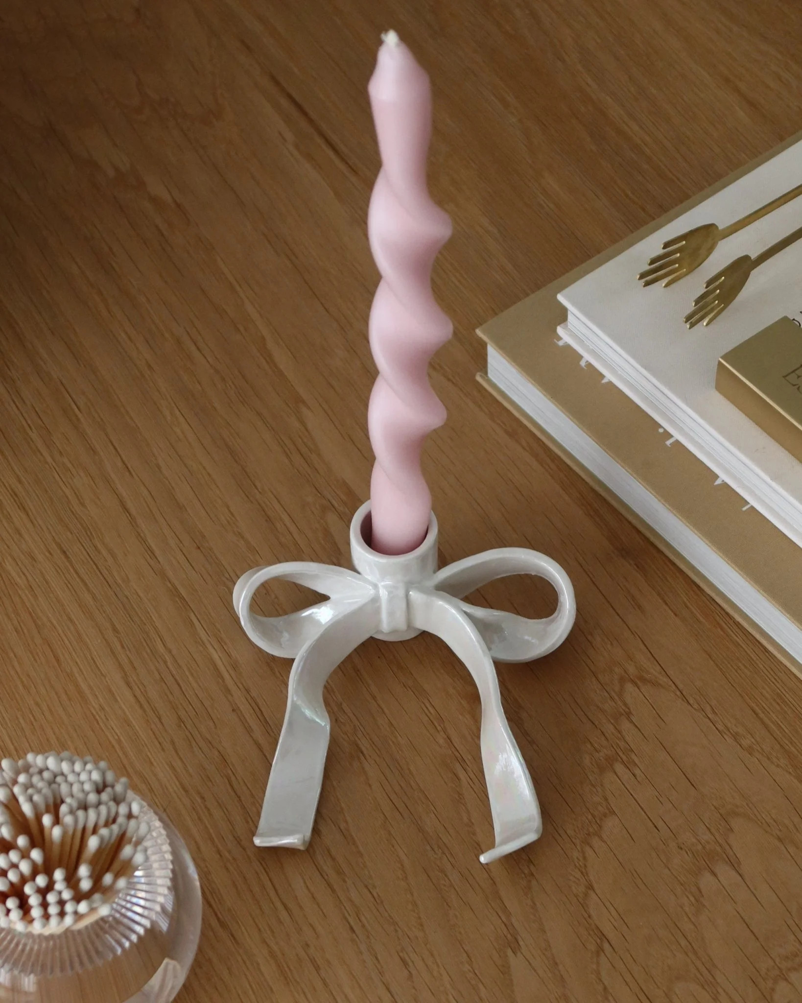 iridescent ceramic bow candle holder

                      -

                      $50 | Cupcakes and Cashmere LLC