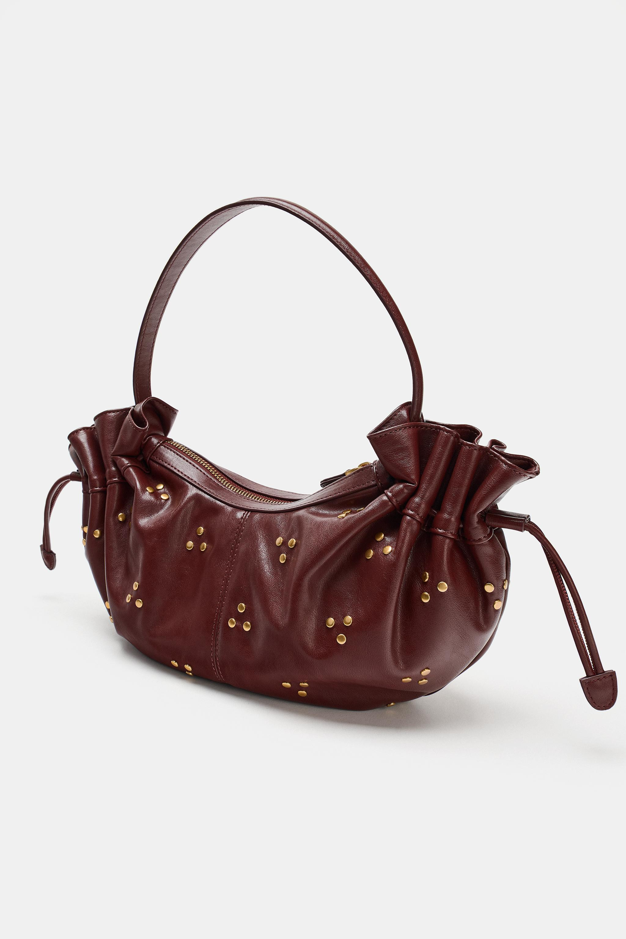 Shoulder bag. Featuring metallic stud detailing and gathered sides with adjustable drawstrings. Z... | Zara US