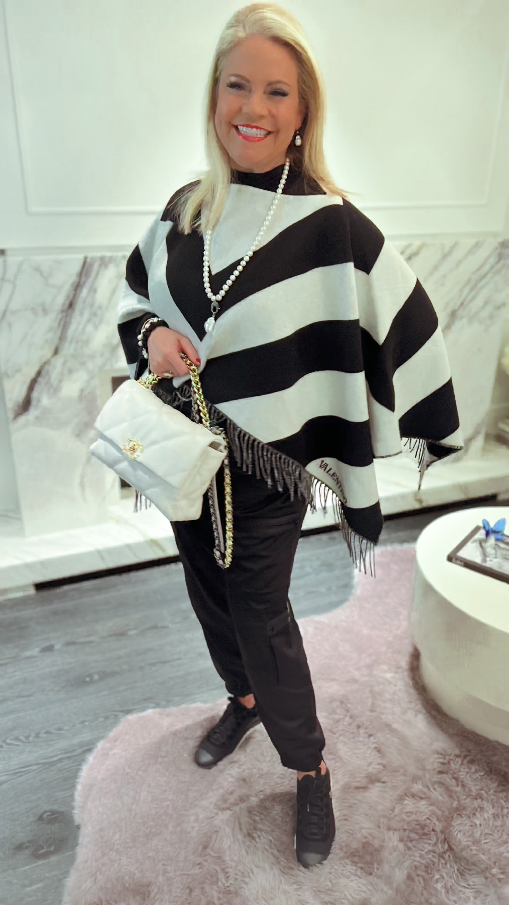 Discounted Valentino cape on sale  Valentino dupes for the same look. Designer poncho. Valentino poncho.  Valentino sweater. Black and white sweater. Black and white poncho  Valentino on sale. 💃💃💃

#LTKover40 #LTKsalealert #LTKSpringSale