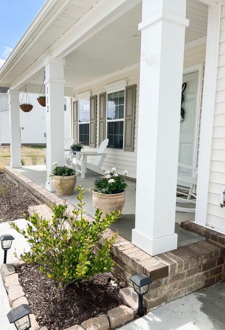 Front porch decor / coastal front porch/ white Adirondack chairs front porch/ front porch coastal decor / southern front porch / planter pots front door / front door decor / coastal front door/ southern/ Easter front porch / southern front porch sitting  front door / hanging baskets front porch / rocking chair front porch 

#LTKhome #LTKunder100 #LTKSeasonal