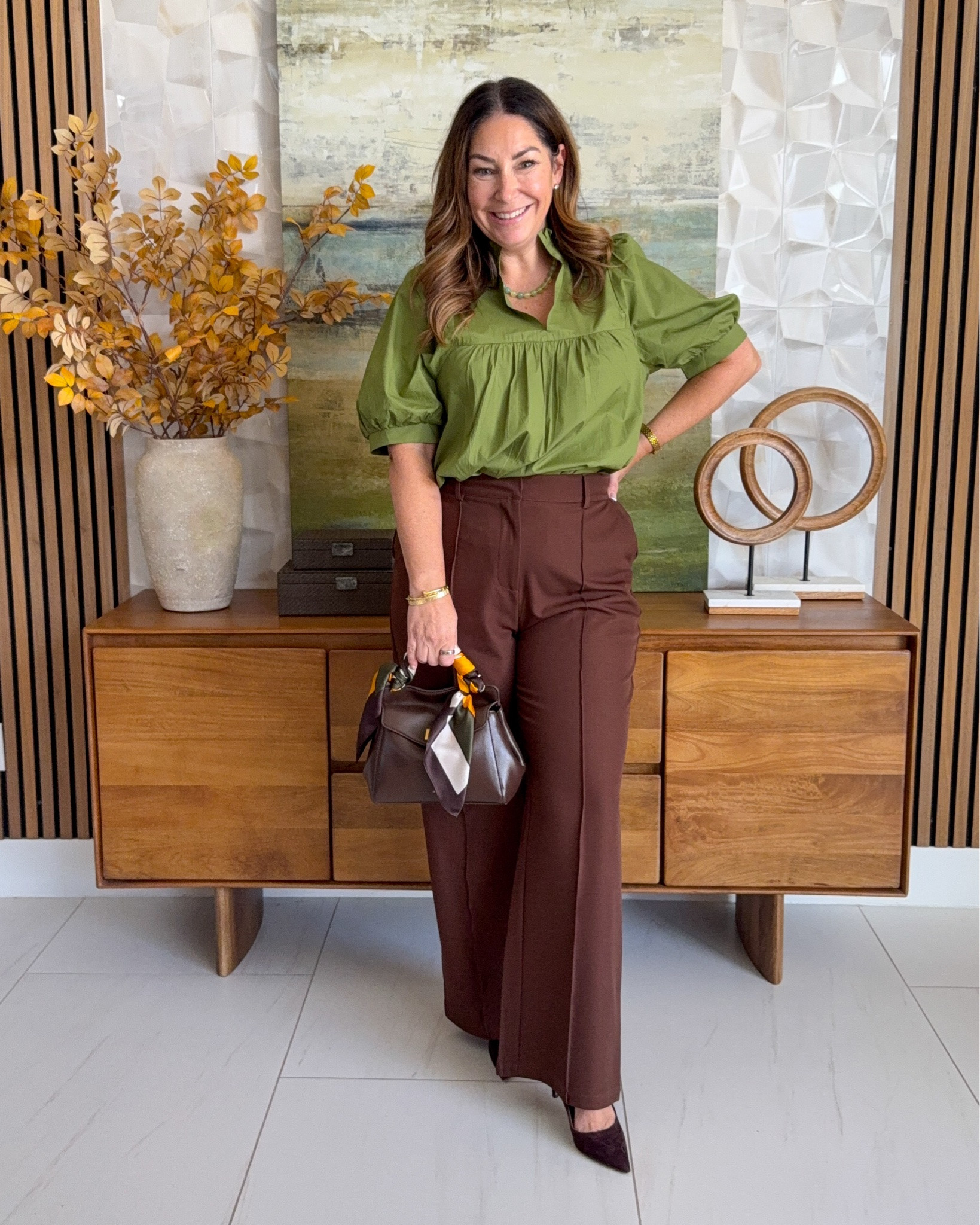 Fall workwear outfit idea 🫒 Olive green puff-sleeve blouse tucked into rich brown wide-leg trousers, styled with a brown bag, a silk scarf, and brown suede pumps. The green + brown color combo is a chic teacher outfit and business casual look.

Sizing: Top tts, L | Pants size up, XL

#LTKOver40