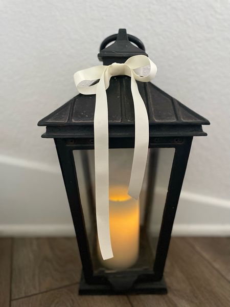 By simply swapping out red ribbon for cream, this black lantern is instantly turned into Winter decor!

#LTKstyletip #LTKhome #LTKSeasonal