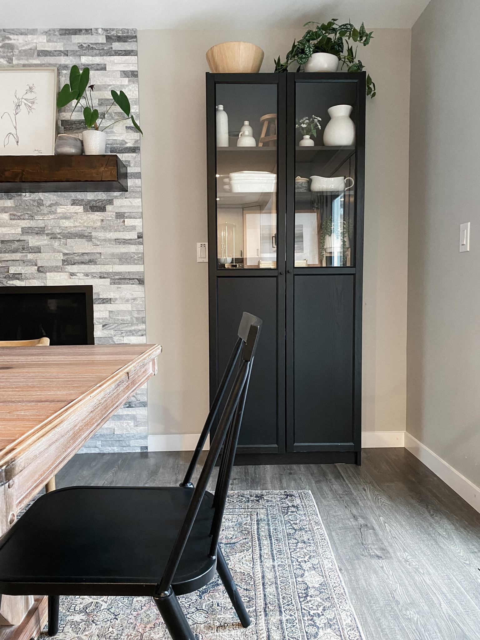 Dining room inspo. Black glass door hutch cabinet server ware storage. Craft cabinet. Ikea home finds. Target finds. Black Metal Windsor chairs. loloi rug thin pile perfect under dining table. 

#LTKfamily #LTKunder100 #LTKhome