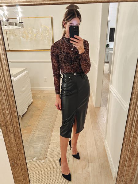 Target outfit idea. Sheer mock neck snake print top with this black faux leather skirt and black heels. Date night outfit. Fall outfit idea. Could also pair with a knee high boot and wear for thanksgiving 

#LTKfindsunder50 #LTKover40 #LTKstyletip