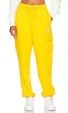 Nike NSW Club Cargo Sweatpant in Yellow Ochre & White from Revolve.com | Revolve Clothing (Global)