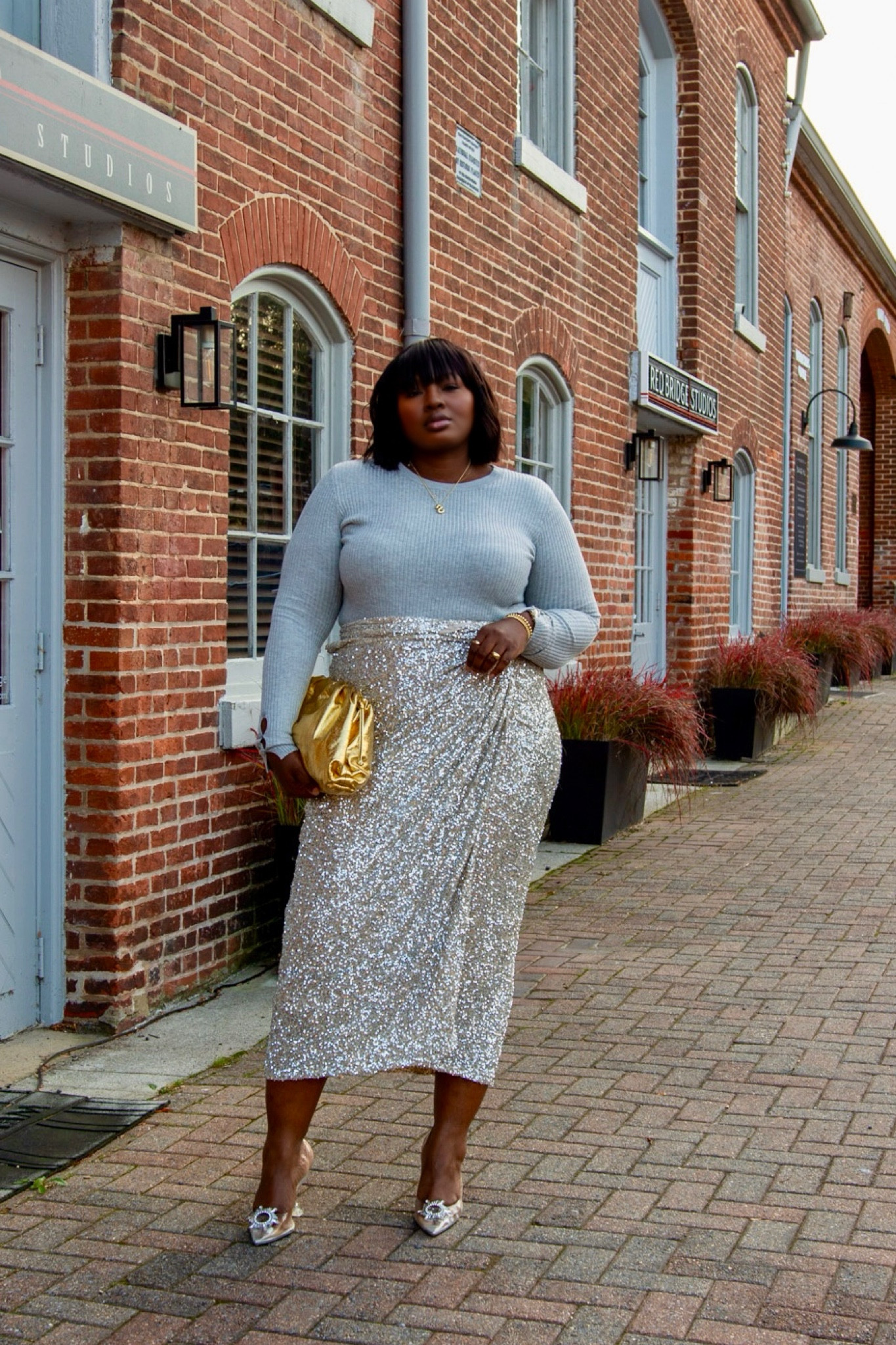 Crossover night outfit - sequin wrap skirt gold clutch statement pumps

#LTKParties #LTKHoliday #LTKMidsize