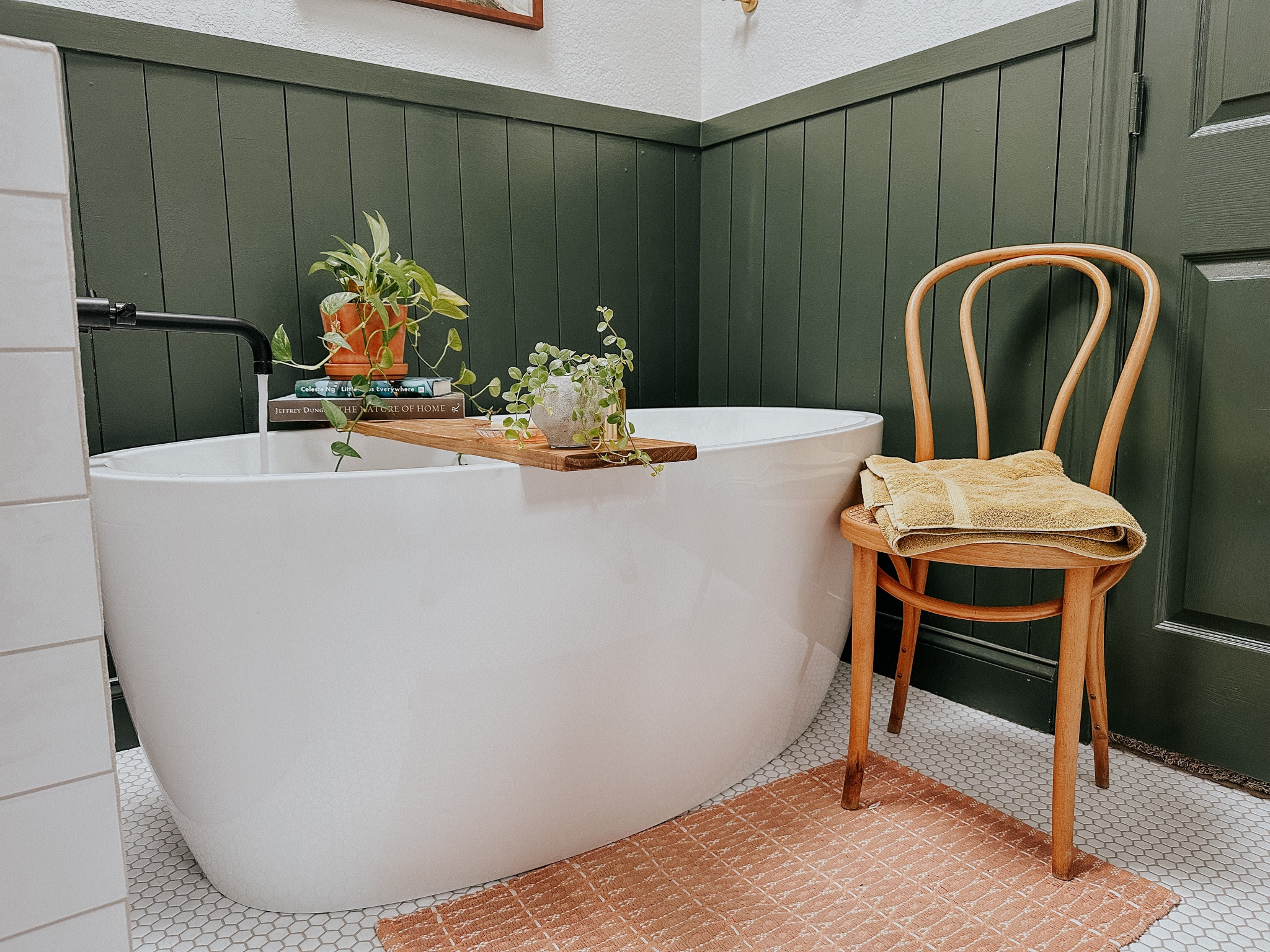 Our green bathroom with freestanding tub. Miss this view. 

#LTKhome