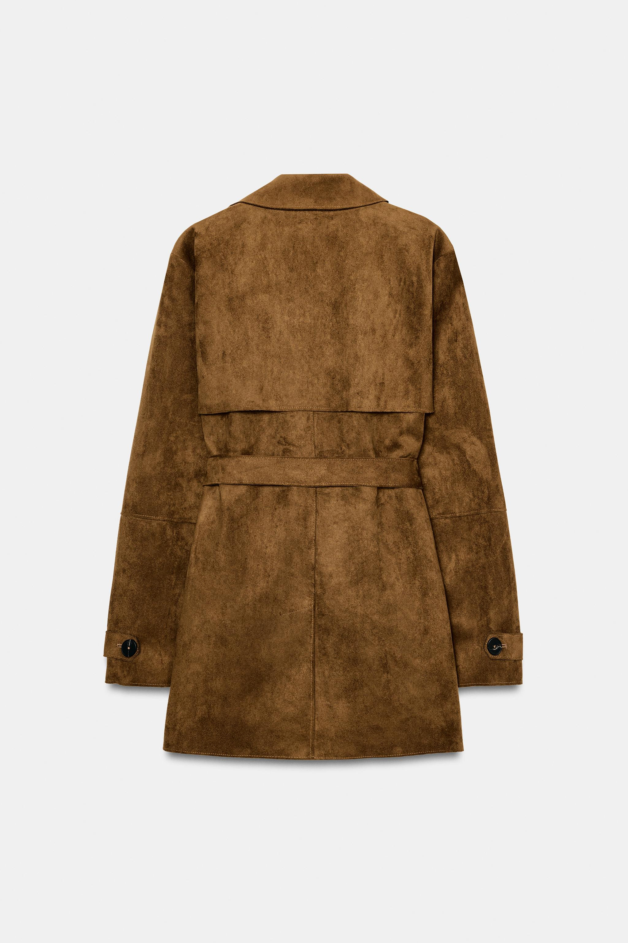 Washed effect trench coat with lapel collar and long sleeves with buttoned tabs. Self belt. Front... | Zara US