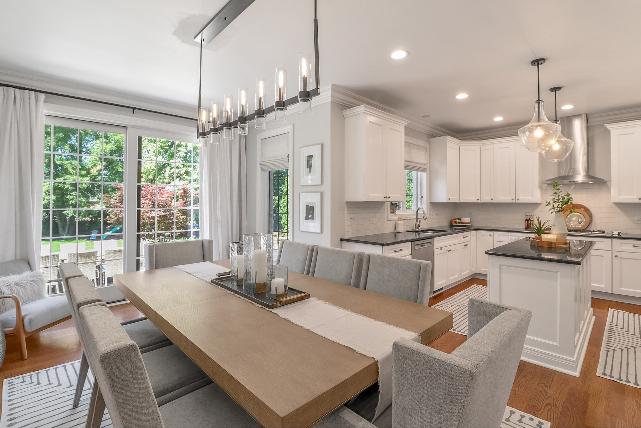 Modern dining room design featuring linear pendant, abstract rug, comfortable seating, tray, candle, centerpiece, table runner, wall art, dining seating, long wood table.

#LTKstyletip #LTKhome