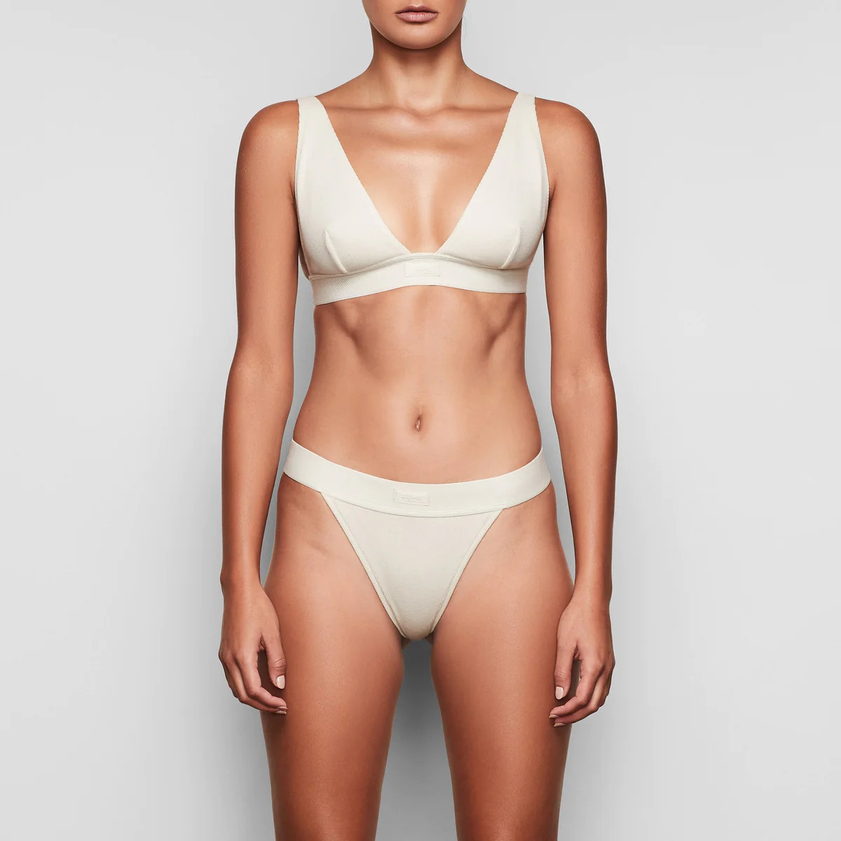 COTTON RIB THONG | SKIMS (US)