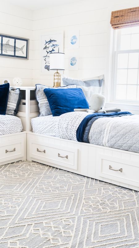 Coastal style shared bedroom for little boys including Pottery Barn beds, blue and white bedding, nautical themed

#LTKhome #LTKkids #LTKfamily