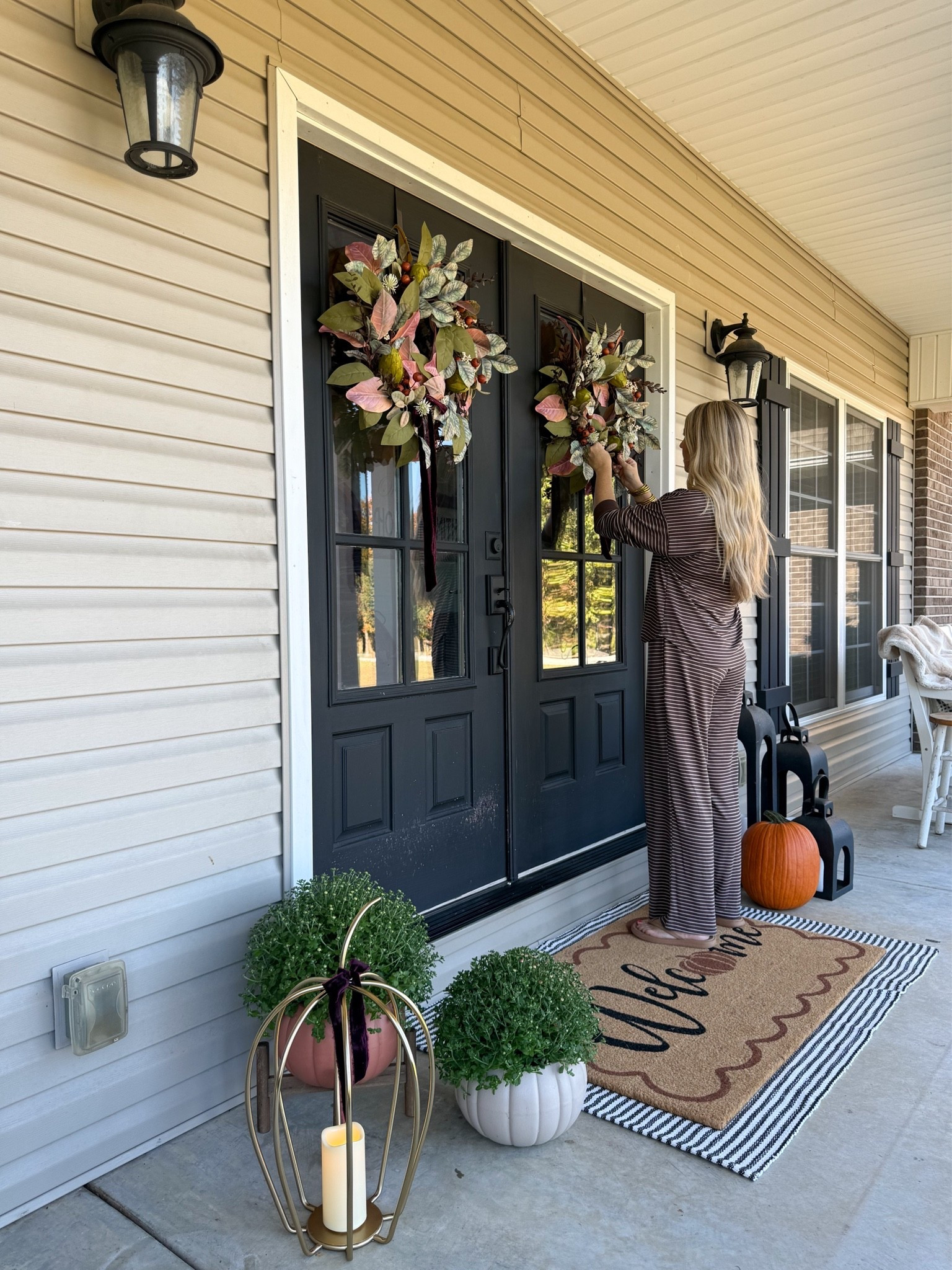 Working on my fall front porch today!! 🍂Of course I’m in my JoySpun lounge set! That chocolate stripe color fits right in. 🤎
I kept things simple this year with some fall wreaths, layered rugs & live mums and real pumpkins!

#LTKSeasonal #LTKHome #LTKootd