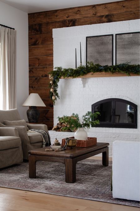 Living room: holiday edition. // mantel decor, winter greenery, swivel armchairs

#LTKSeasonal #LTKHoliday #LTKhome