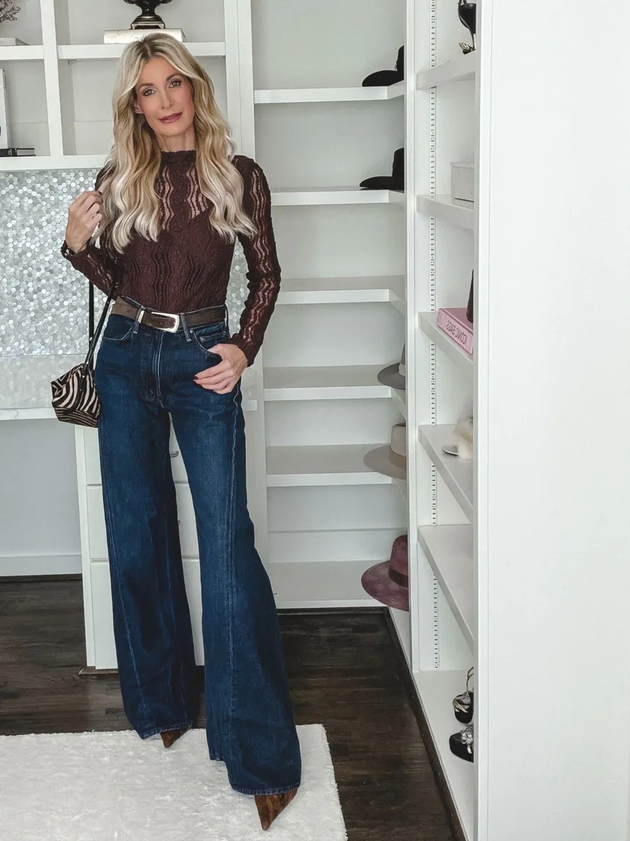 Wide leg jeans + an oversized top = no balance. Here's the fix 👇 The mistake I see most often: pairing wide leg jeans with a boxy top or slouchy jacket. When both halves are full, the volume swallows your frame. The formula that works: 1. Volume on the bottom: these high-waisted Mother Lemon Twist wide leg jeans. The dark wash is made for fall. 2. Fitted on top: this burgundy lace mesh top hugs the body and defines your waist. 3. The result: balanced proportions, a longer leg line, and a polished look that still feels effortless. Sizing: both pieces run true to size. I'm wearing a 24 in the jeans and an XS in the top. 

 

#LTKootd #LTKSeasonal #LTKOver40