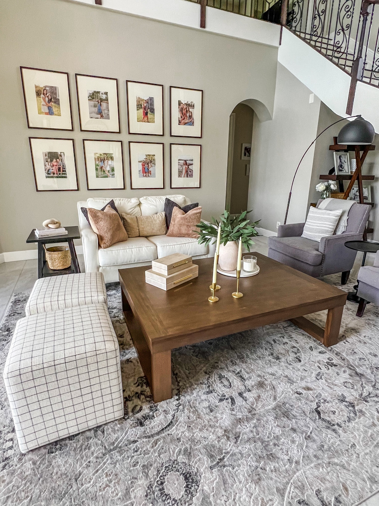 This living room gives all the inviting comfy vibes. Soft area rug, square ottomans, gorgeous large coffee table, floor lamp and gallery wall tie it all together. 

#LTKsalealert #LTKhome #LTKfamily