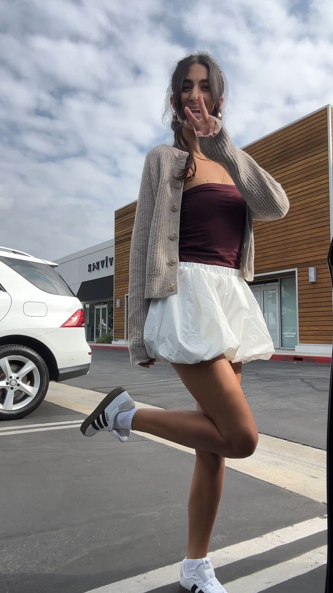 Work outfit, white shorts, tube top. Adidas shoes 