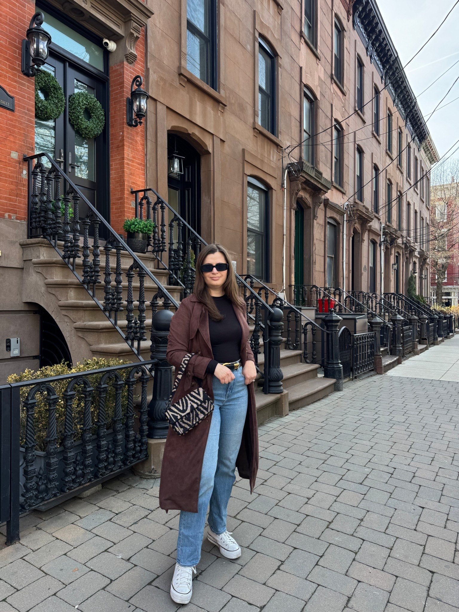 Easy spring outfit! A long sleeve top and jeans with a fun statement coat. This faux suede trench gets so many compliments when I wear it and wore my sneakers perfect for walking. Mixed in the zebra beaded bag and sunglasses! 

#LTKSeasonal #LTKootd #LTKPlusSize