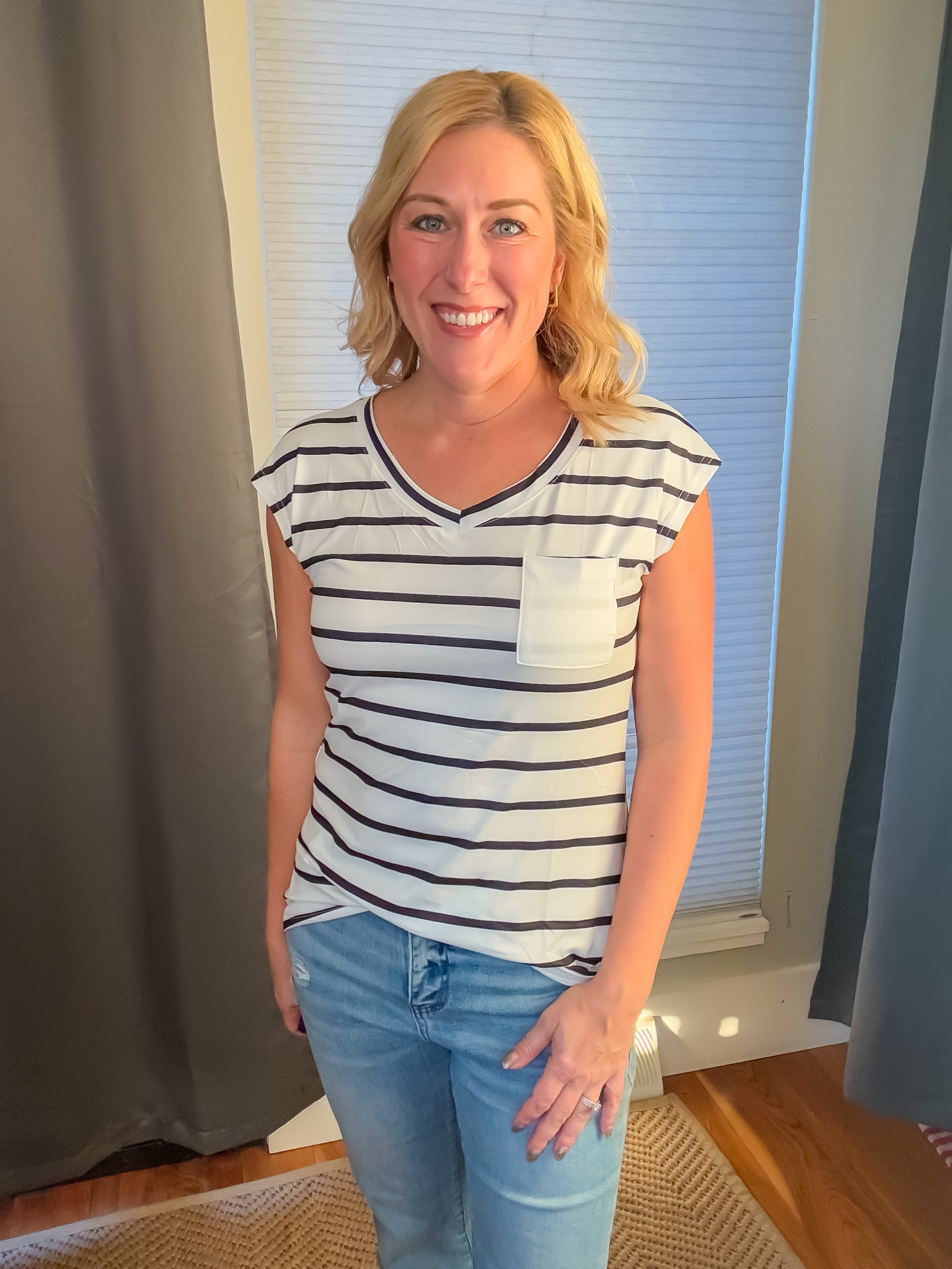 I love the stripes and cute pocket on this cap sleeve tee! The fabric is light, soft, and comfortable.
